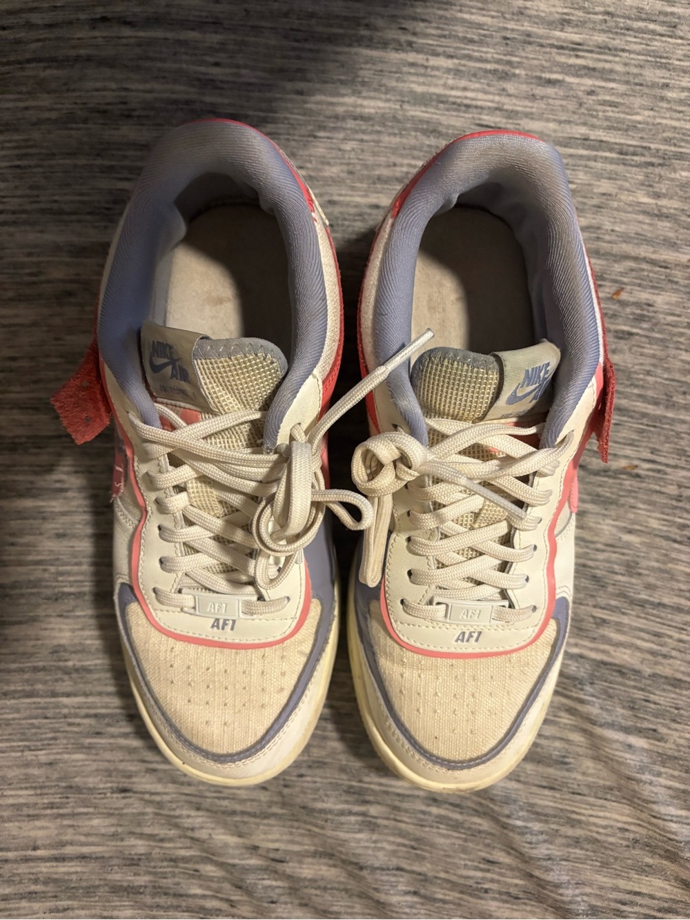 Nike Women’s Low-Top Sneakers in Cream and Pink Accents